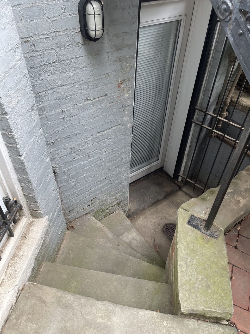 Five stairs down to the the apartment door.