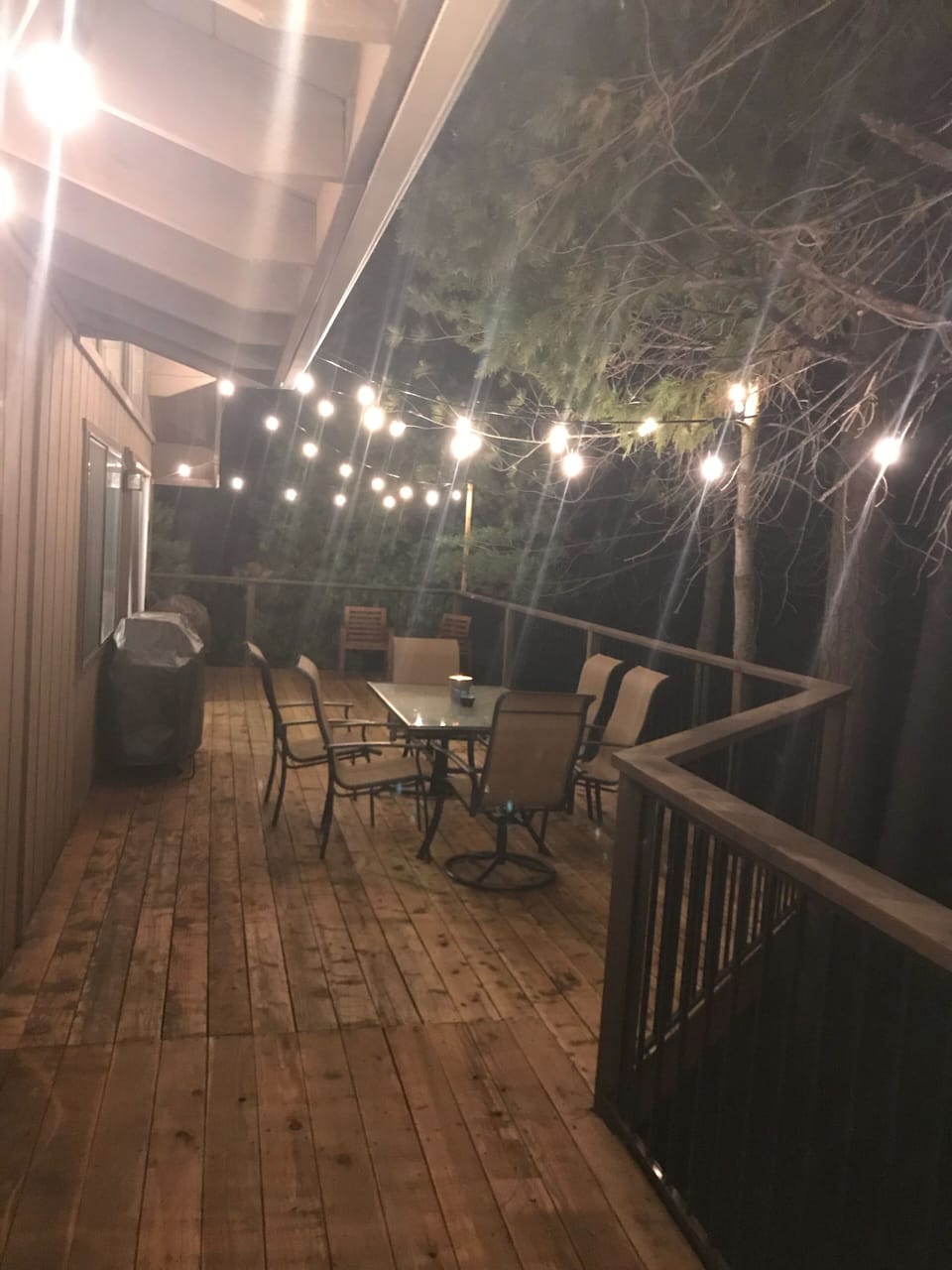 Back deck at night with updated grill and fire pit for those cook outs!