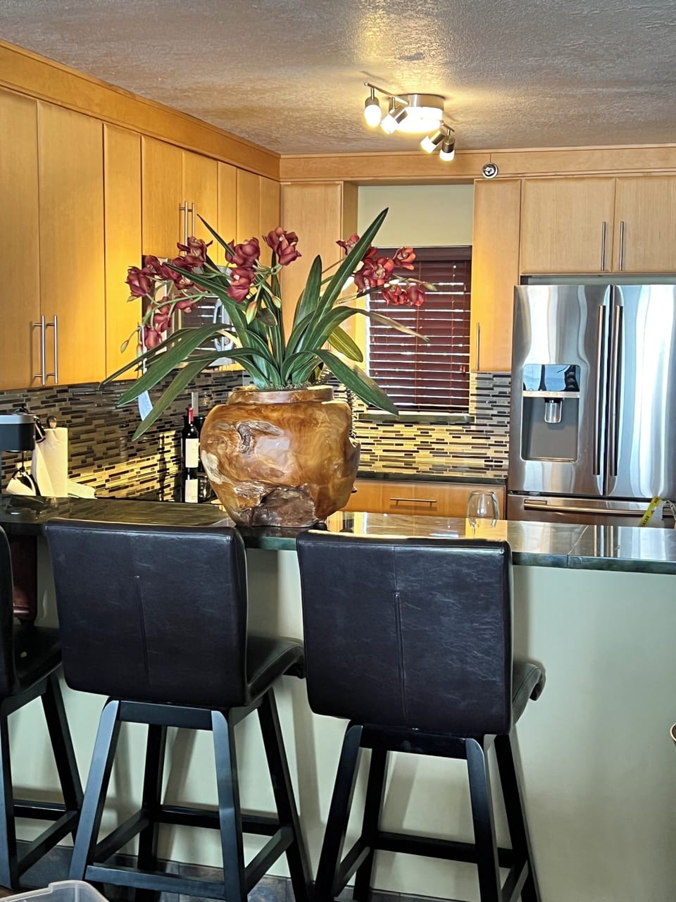Kitchen with view of refrigerator