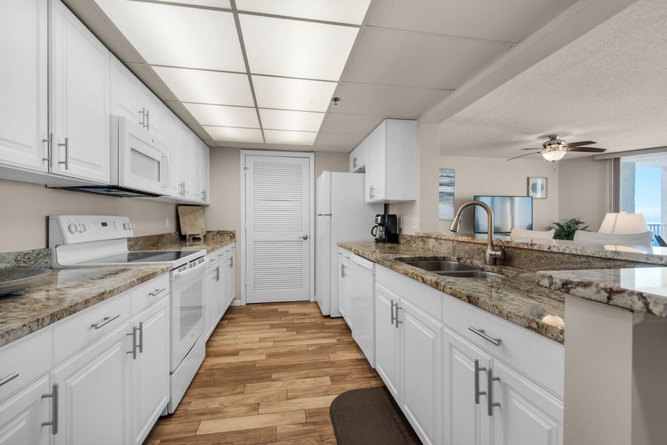 Top-of-the-line kitchen. New cabinets, granite counters, glass top range