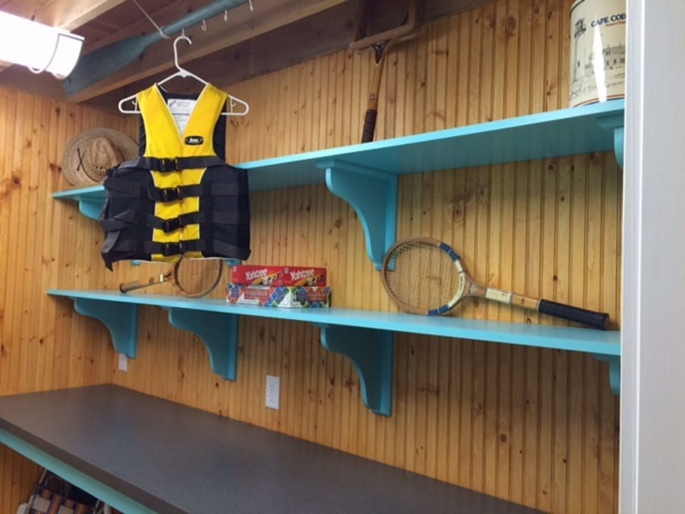 Laundry room (bare in this picture!), really has 8-10 life jackets and games.