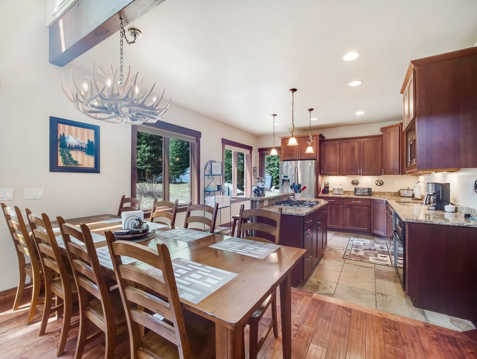 Kitchen with Door to Deck, Two Extra Chairs for Table in Master