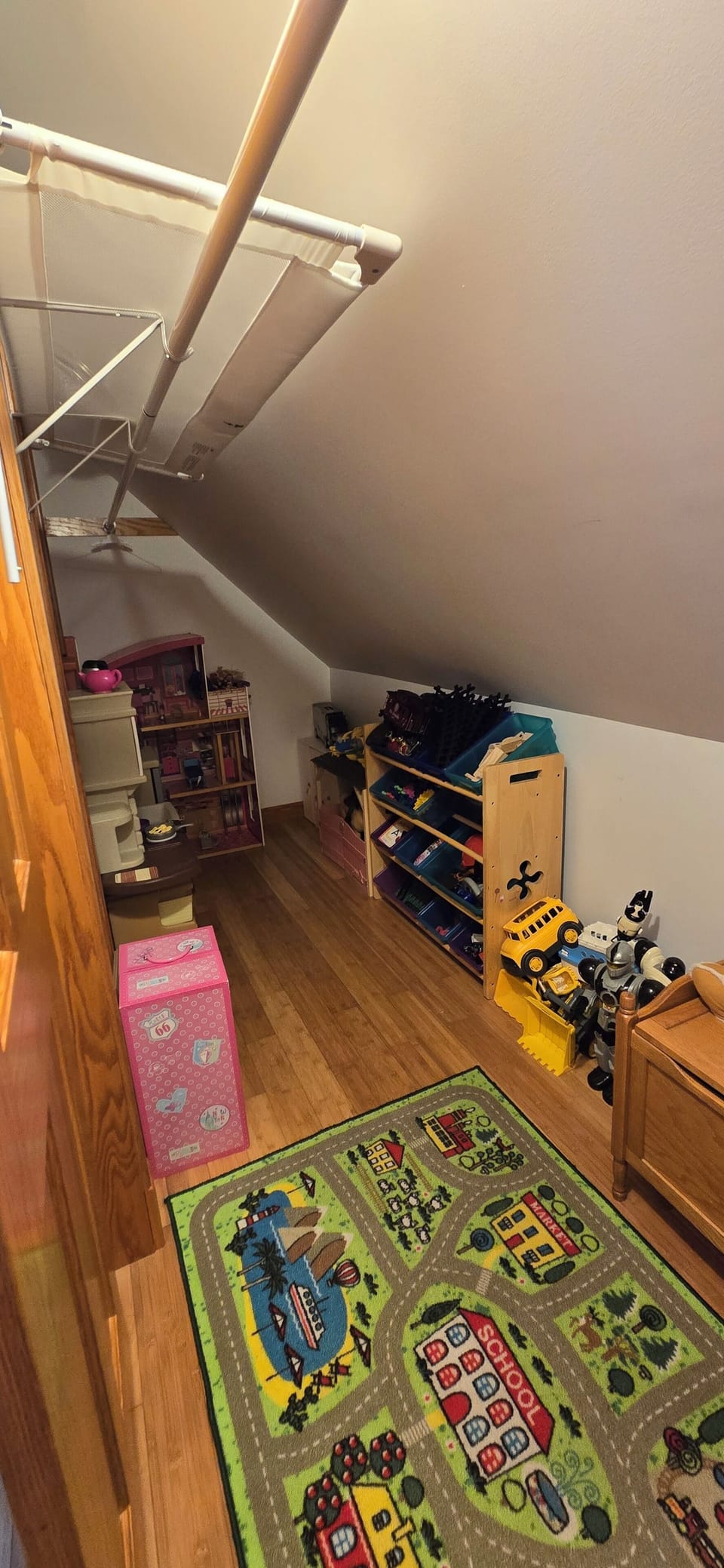 Toy closet in the upstairs bedroom with a full bottom bunk
