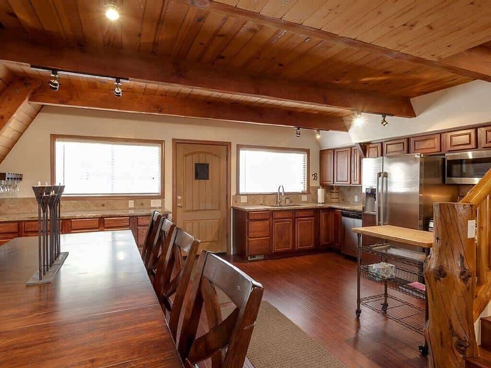 Open Kitchen with dining table to sit 8 comfortably.