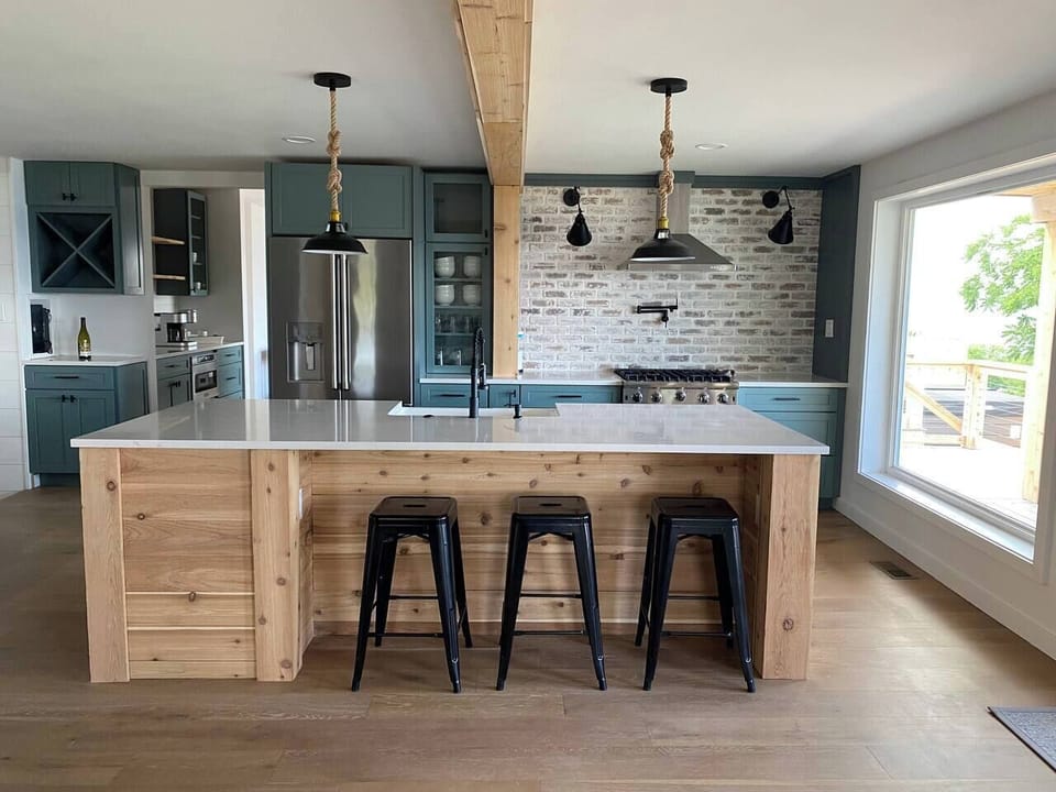 Open concept kitchen, includes standard appliance package + beverage fridge +oven with pot filler