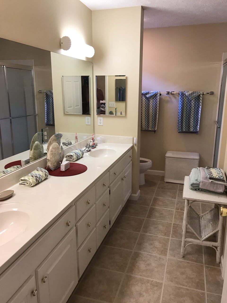 Master bathroom with step in shower and 2 sinks. 