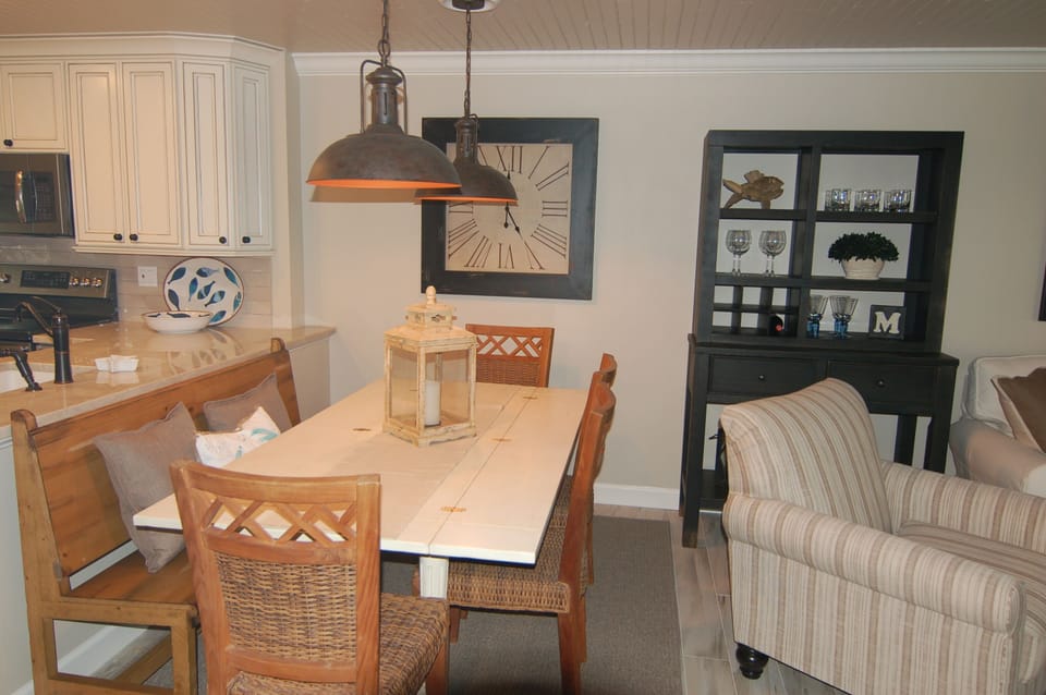 Our dining table seats seven and has a separate bar for your use!  
