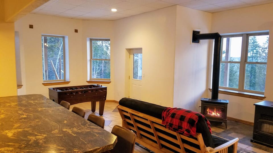 Downstairs offers propane stove, Foosball table, and full size futon