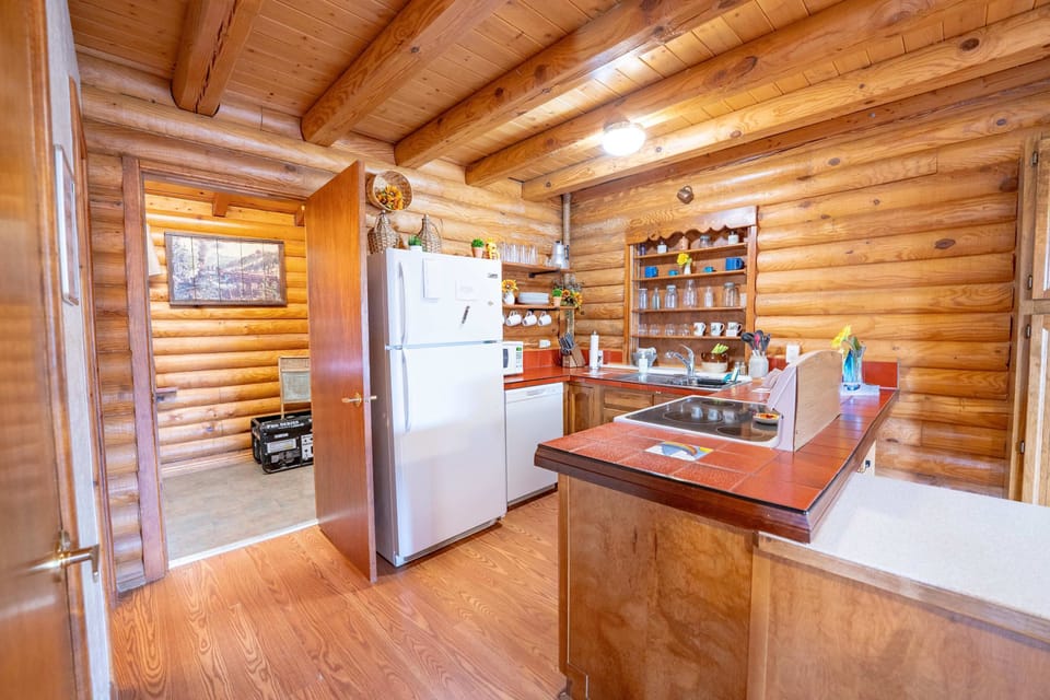 The cozy kitchen features all the appliances and essentials you need to feel right at home.