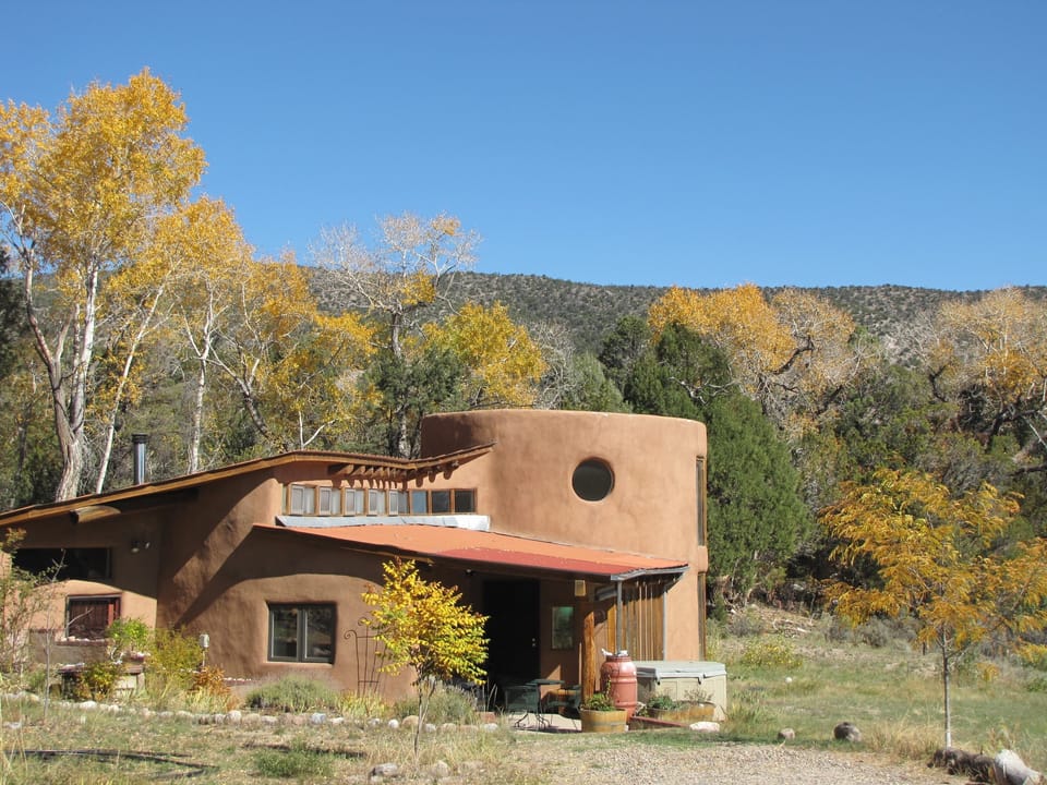 Custom Designed Passive Solar Adobe Home, curved walls, high ceilings, big views