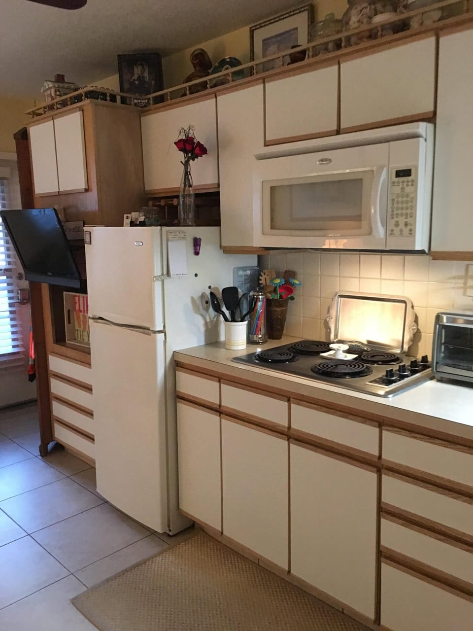 Kitchen Area Stove Microwave and toaster oven