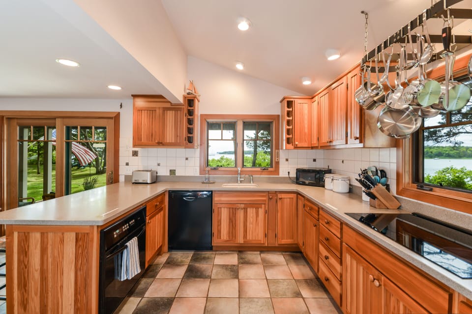 Kitchen with oven, dishwasher and induction stove top. 