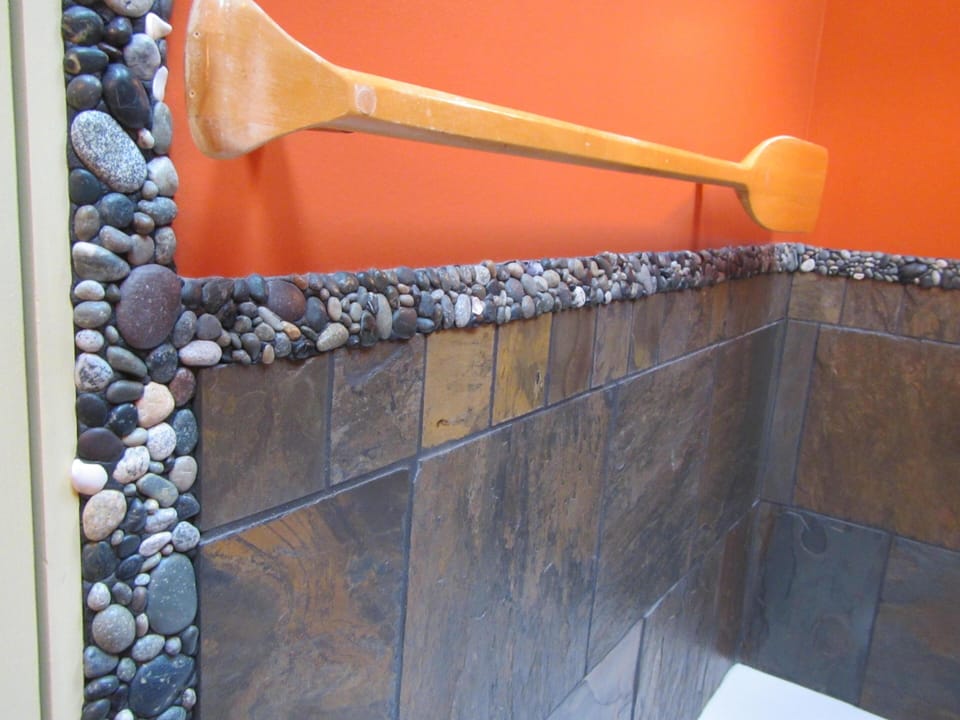 Each bathroom is trimmed with west coast ocean polished rock which is individually placed