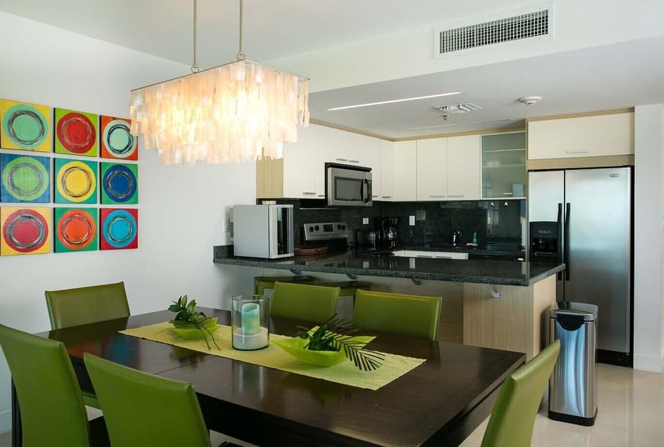 Picture yourself preparing a meal in your stylish kitchen with sleek appliances and modern finishes, then gathering around the dining table under warm lighting to enjoy every bite together.