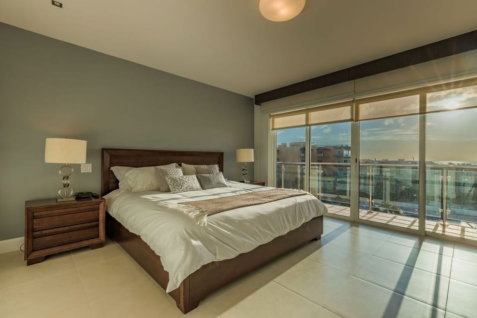 Wake up refreshed in your spacious bedroom, where soft linens and soothing tones invite relaxation. Step onto your private balcony to greet the day with sweeping city views and abundant natural light.