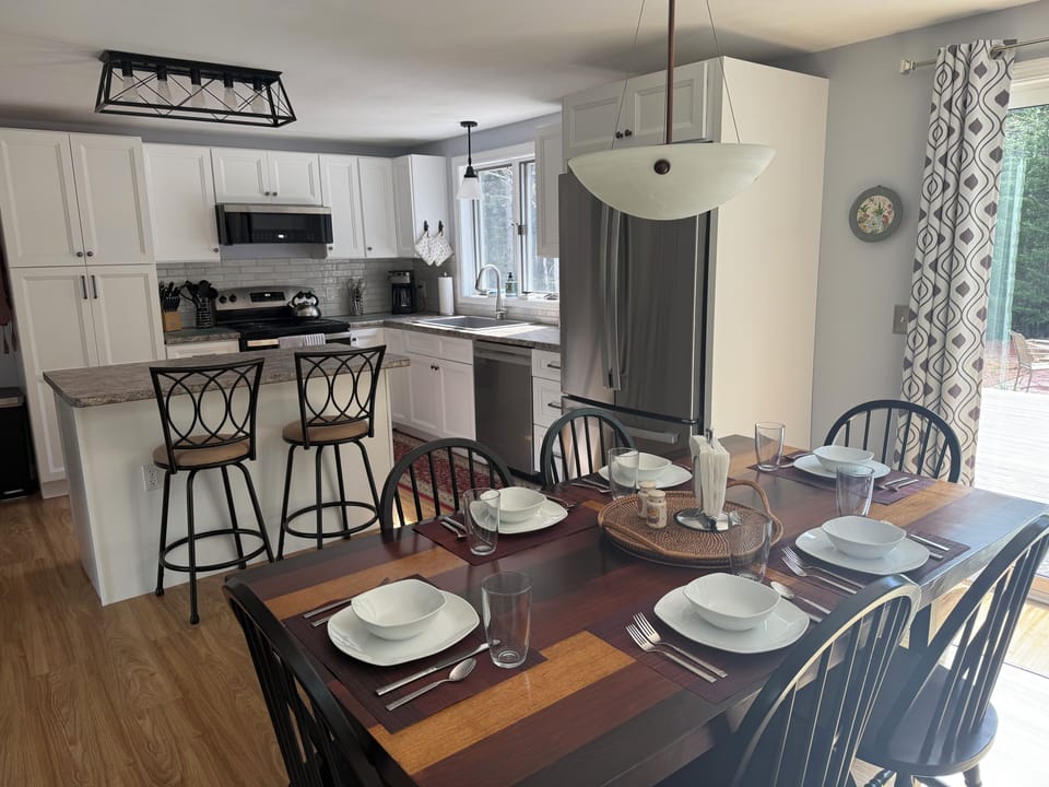 Dining sets up to 8 at the table and 2 at the island.