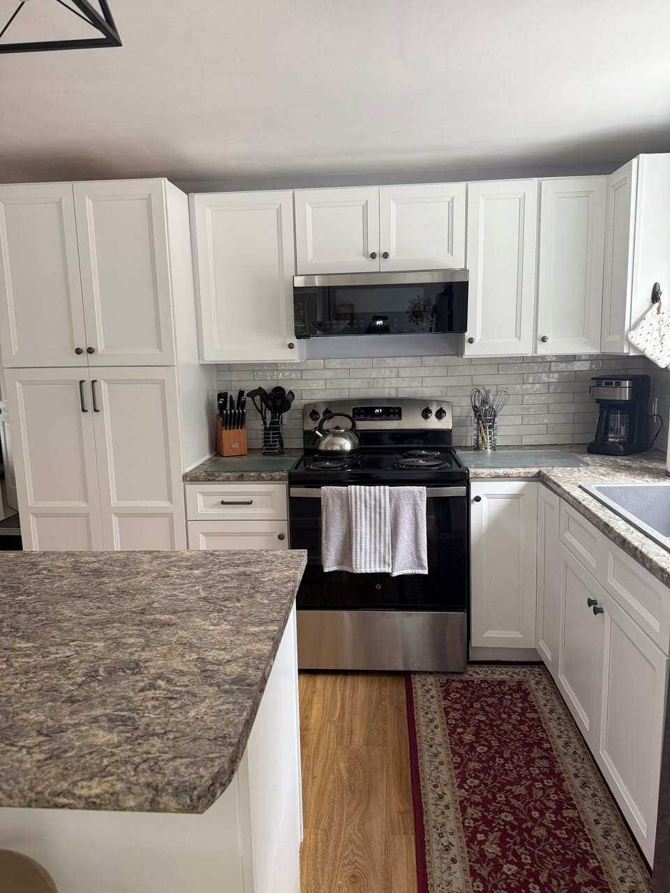 2025 Updated kitchen - cabinets, countertops, appliances, lighting and tile.