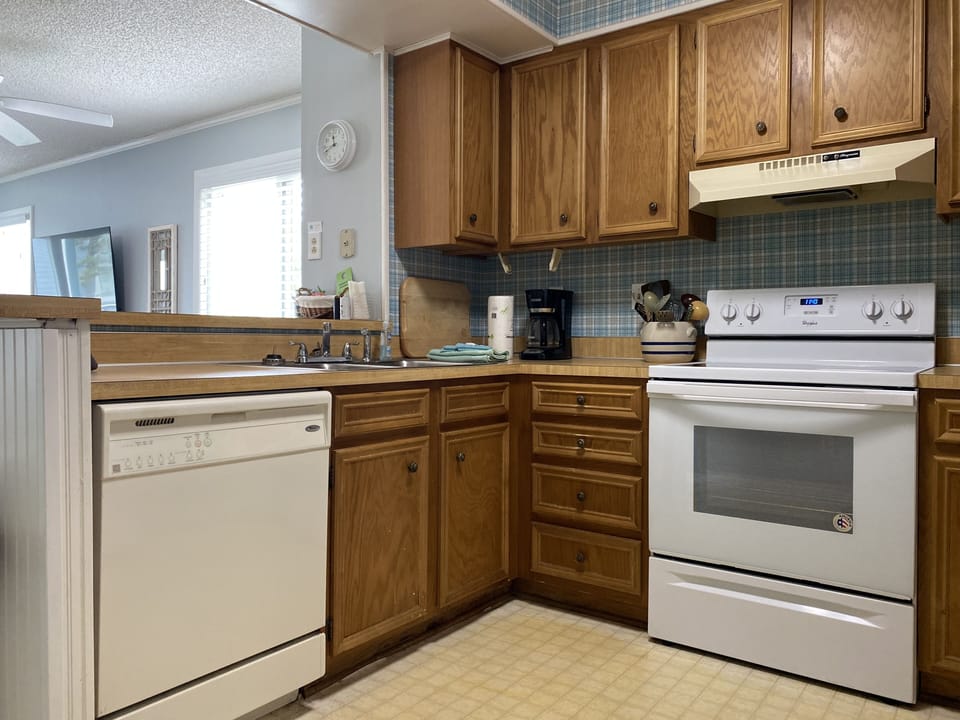 Kitchen with oven, refrigerator, dishwasher, microwave, toaster & coffee maker