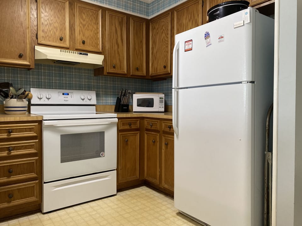 Kitchen with oven, refrigerator, dishwasher, microwave, toaster & coffee maker