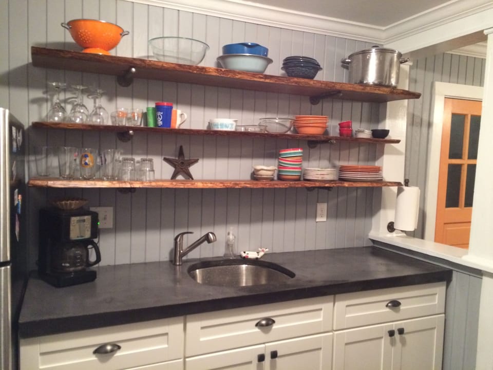 Fully equipped kitchen, stainless steel appliances.