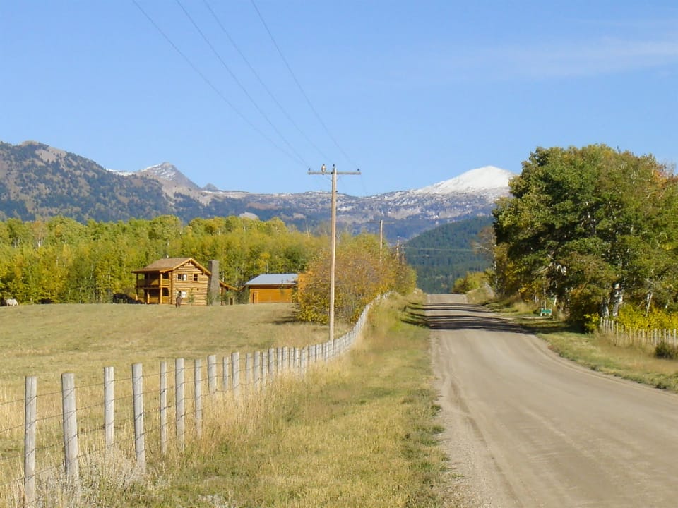 Colter cabin and the Tetons, as seen on approach from the west.