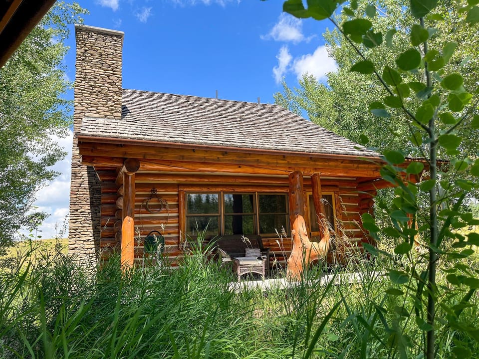 Charming two-story hand-peeled log cabin set amidst the aspens.