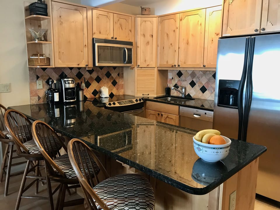 Full kitchen with stainless steel appliances