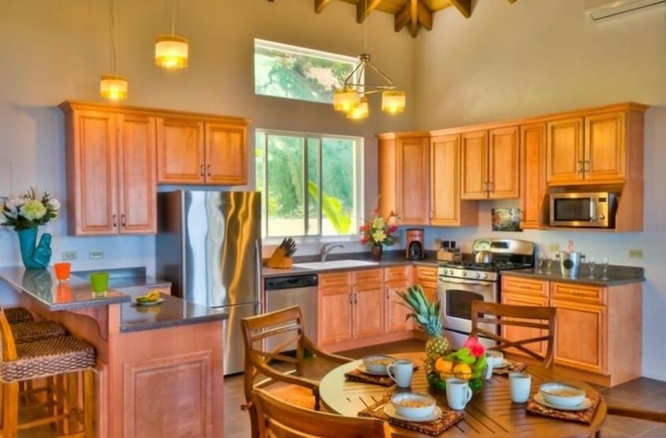 Well equipped kitchen with indoor dining and bar seating