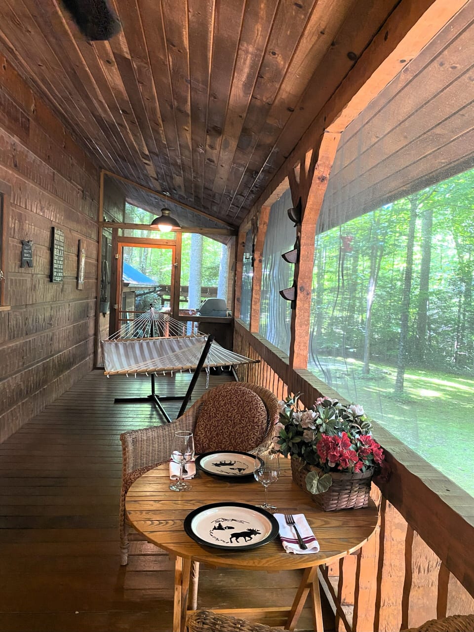 Dine or have a cocktail on the screened back porch, or sway in the hammock