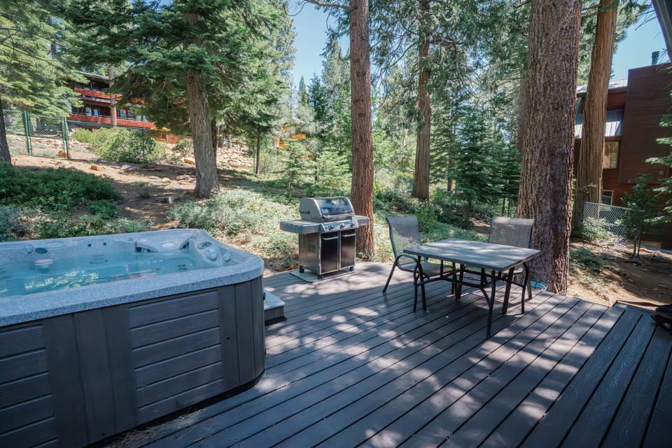 The outdoor hot tub offers the ultimate relaxation, perfect for enjoying the fresh air and unwinding after a long day of hiking, skiing, or sightseeing