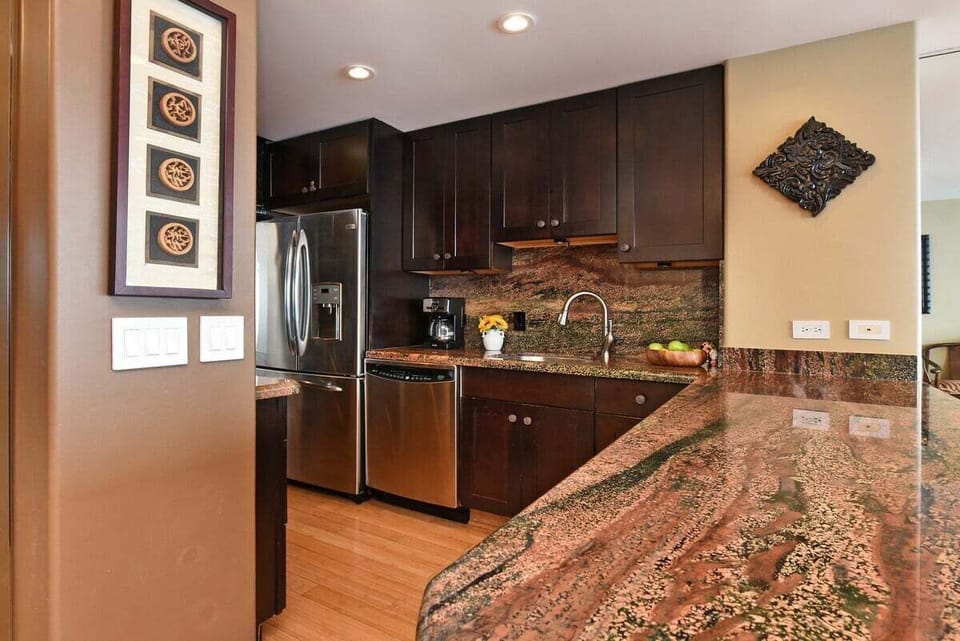 Spacious granite countertop, perfect for preparing meals