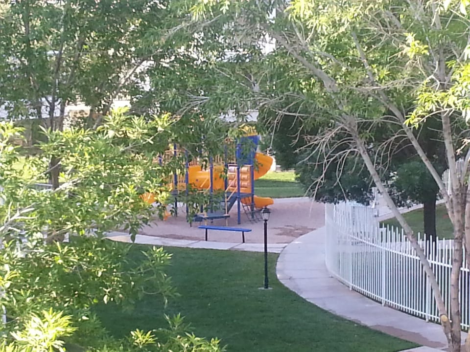 View of playground and pool area from the deck.
