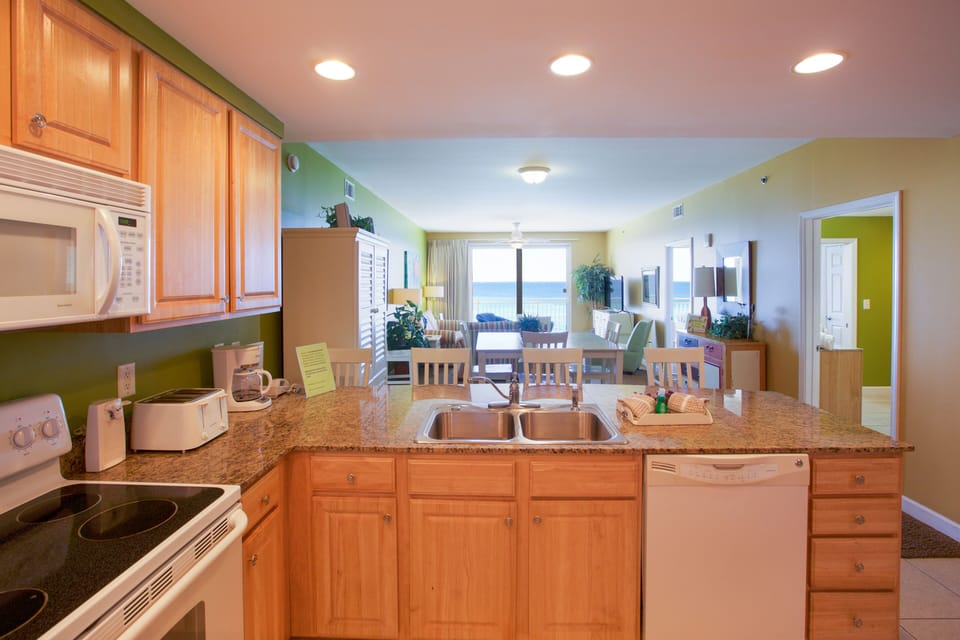 Kitchen complete with range, microwave, dishwashesr & full size refrigerator