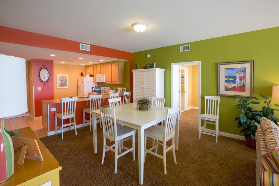 Large dining table with additional counter/bar seating.