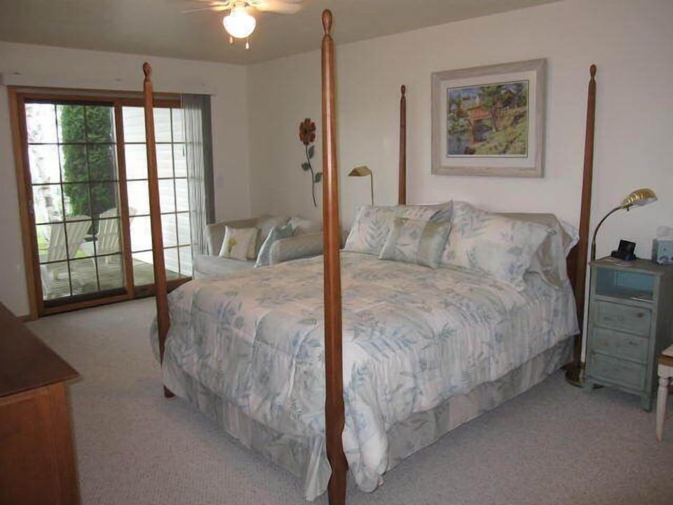 The roomy master bedroom features a queen bed with new mattress and cable TV