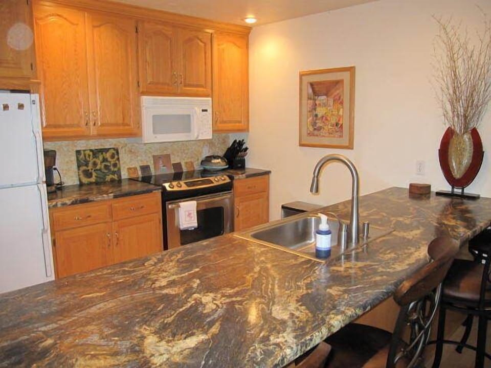 The kitchen is fully equipped including a dishwasher