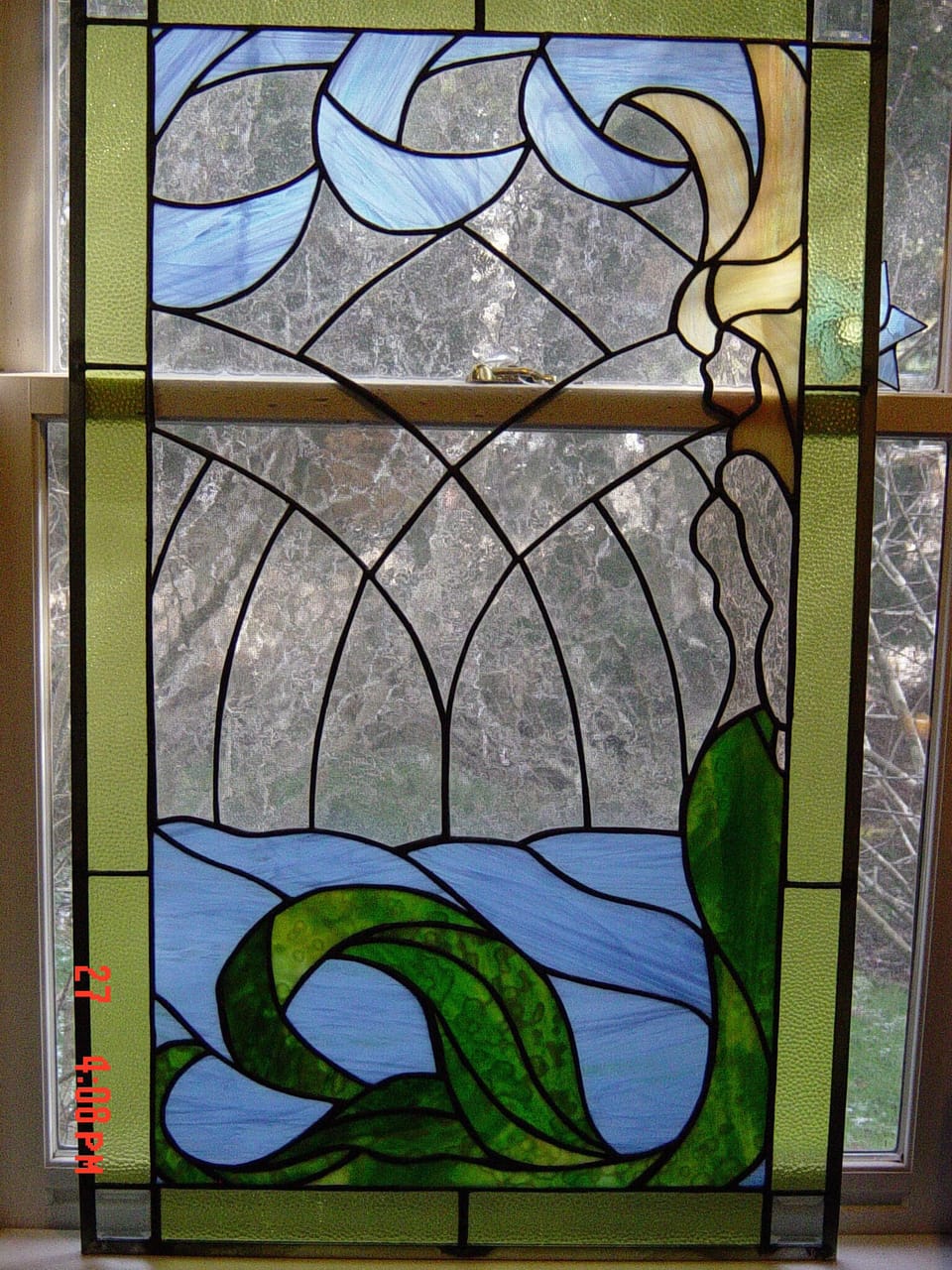 owners stained glass..do you see the Mermaid?