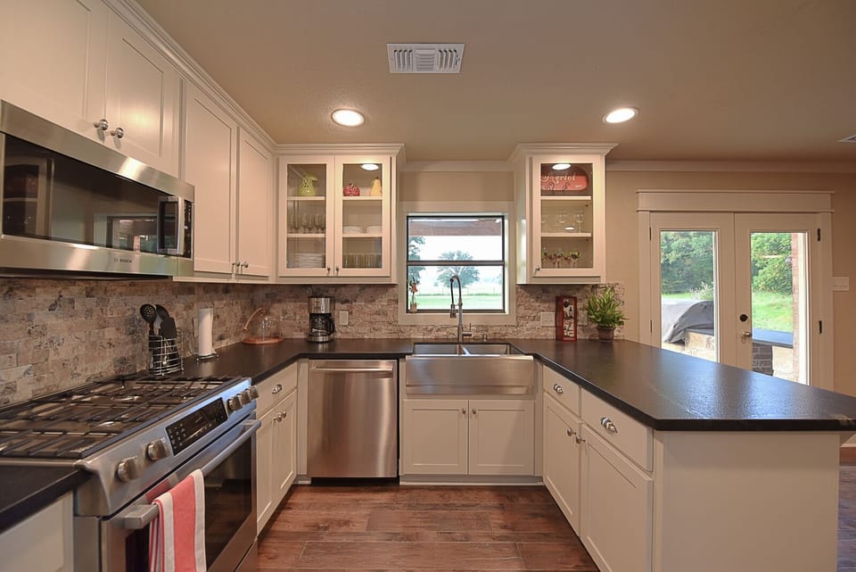 Kitchen with granite counter tops and stainless steel appliances