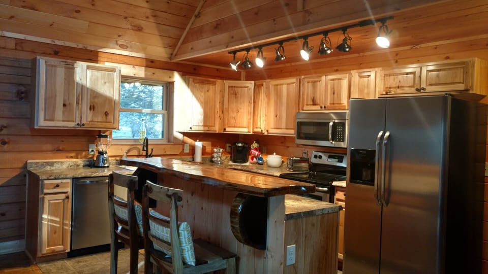 Curly maple bar top in a well equipped kitchen