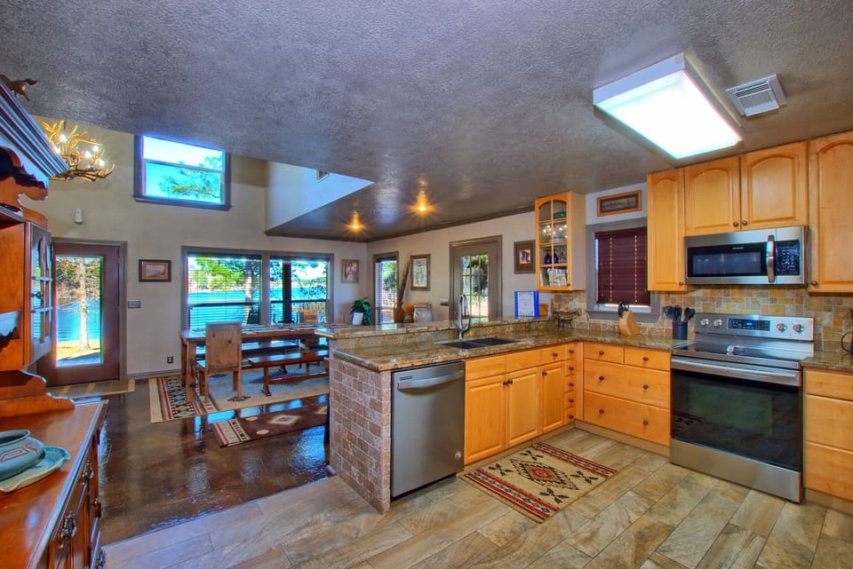 The kitchen has a view of the lake.