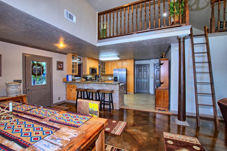 The loft has a double bed and is accessible by the ladder. 