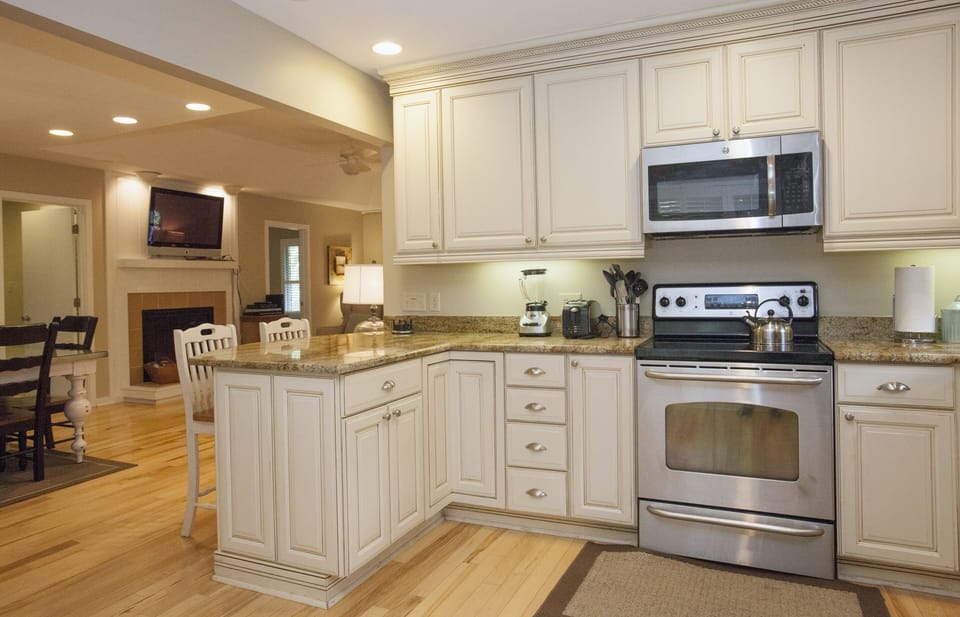 Great Kitchen fully stocked! Looking into living area