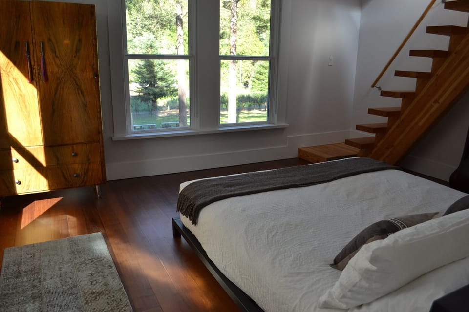 The Primada Suite has a sleeping loft and a beautiful view of the fields & lawn.