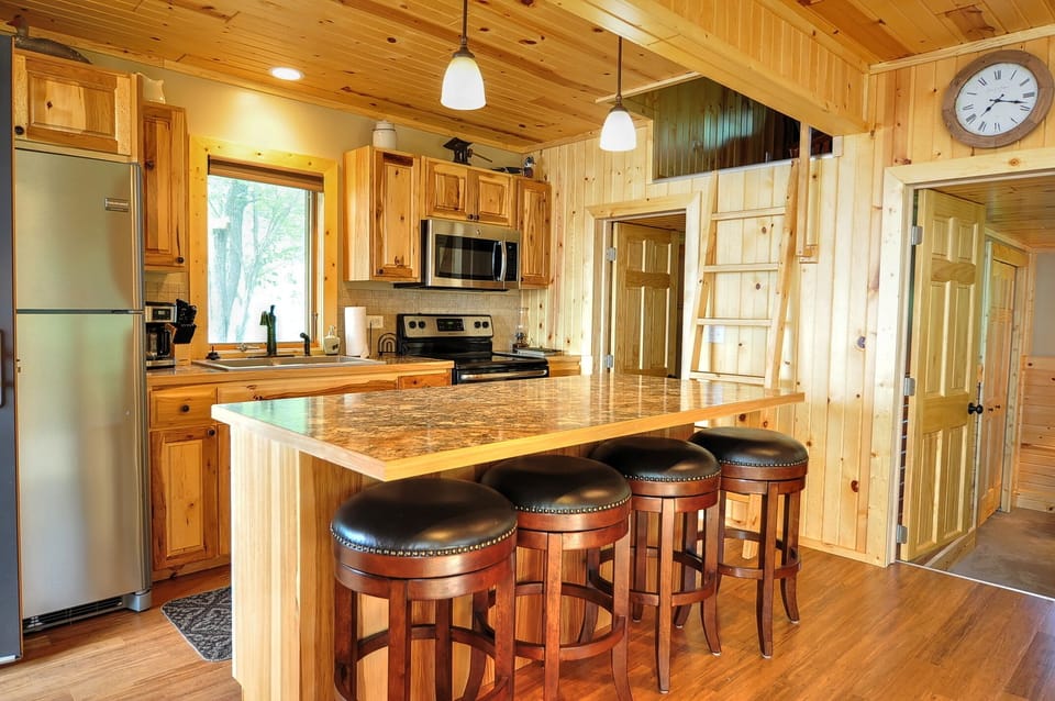 Gourmet kitchen with stainless appliances.