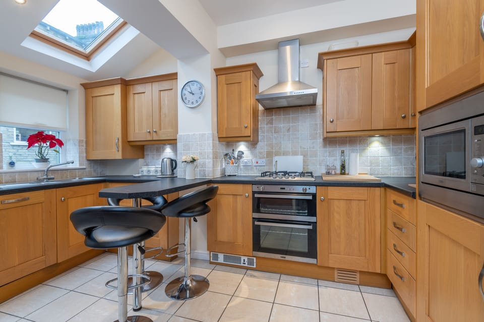 Fully Equipped kitchen with under cabinet lighting  