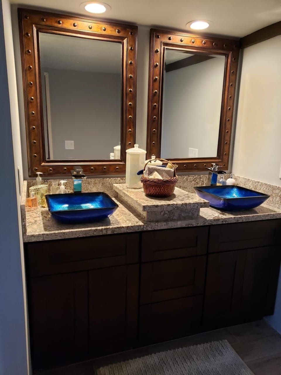 Master bath with glass double vanity sinks