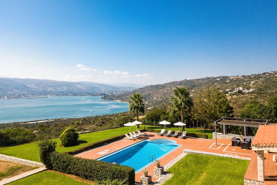 The pool terrace is equipped with sun beds and umbrellas