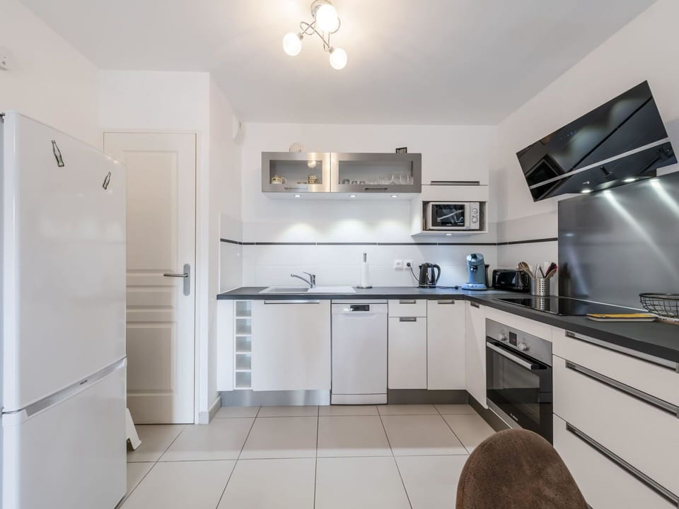 Cabinetry, Countertop, Sink, Kitchen Stove, Kitchen Appliance, Home Appliance, Kitchen, Interior Design, Flooring, Wood
