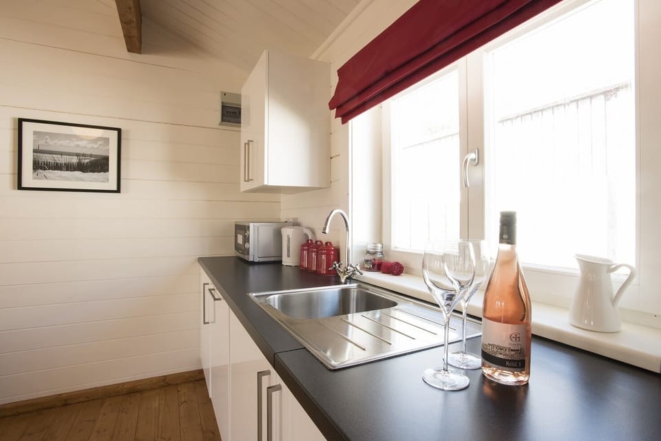 Well-equipped kitchen with oven, hob, microwave and dishwasher