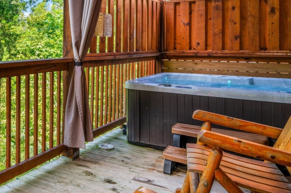 Ease into the hot tub once the pool towels are hung up — your own private soak just steps from the pool room, curtained off for total privacy.